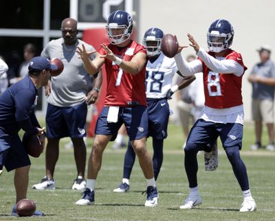 Tennessee Titans quarterbacks Marcus Mariota (8) and Blaine Gabbert (7) take a snap during an organized team activity at the Titans’ NFL football training facility Tuesday, June 5, 2018, in Nashville, Tenn. Titans offensive coordinator Matt LaFleur wants to make sure Mariota is as comfortable with Tennessee’s new offense as possible, planning to call plays that fit his quarterback best. (Mark Humphrey / Associated Press)