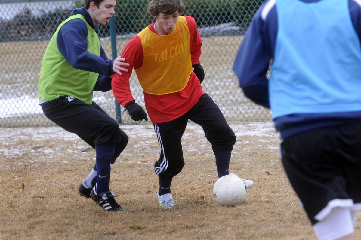 Central Valley seniors, defender Alex Riel, left, and midfielder Devin Allen, battle for the ball during practice on Tuesday. (J. Bart Rayniak)