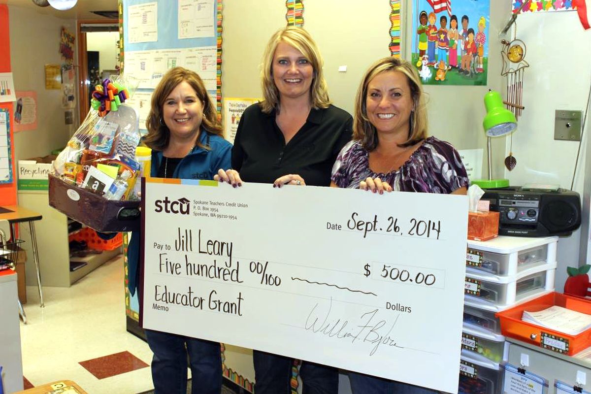 Jill Leary, a third-grade teacher at Garfield Elementary School, right, received a $500 classroom grant from STCU. Also pictured, from left: Laura Lesser, STCU main branch manager; and Laura Enquist, STCU director of branches.