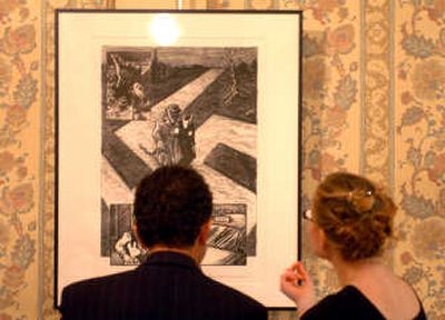 
A couple check out artwork up for auction at last week's Works from the Heart. 
 (Photos by Jesse Tinsley / The Spokesman-Review)