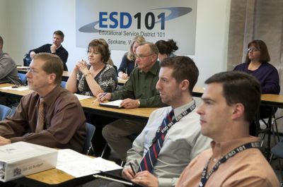 School leaders in the Spokane area   meet at the Educational Service District  center Tuesday to pore over the Senate and House budgets in a Web conference with state officials.  (Colin Mulvany / The Spokesman-Review)