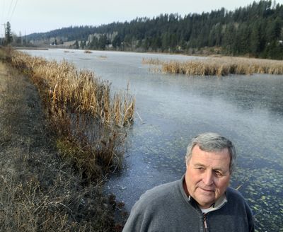 Jon Jones, with the Washington state Department of Ecology Water Quality Program, stands at the Little Spokane River headwaters south of Newport, Wash., on Wednesday. (Dan Pelle)
