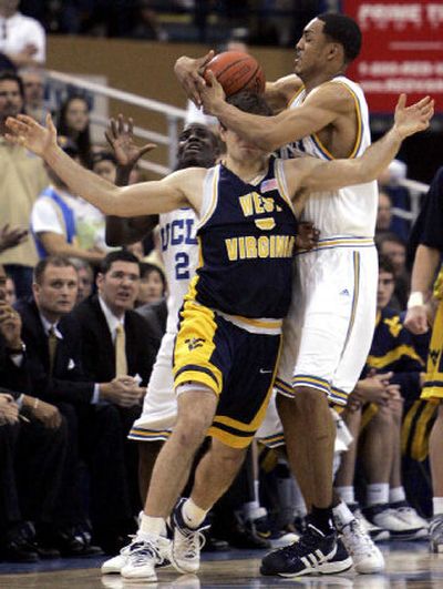 
UCLA's Ryan Hollins, right, steals the ball from  Johannes Herber.
 (Associated Press / The Spokesman-Review)