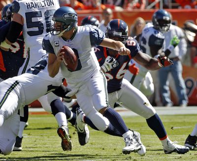 The Denver pass rush kept the pressure on Matt Hasselbeck last Sunday, playing a big part in the Seahawks quarterback’s three interceptions. (Associated Press)