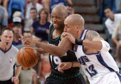 Timberwolves' guard Sam Cassell feels the pressure of the Kings' Doug Christie. Timberwolves' guard Sam Cassell feels the pressure of the Kings' Doug Christie. 
 (Associated PressAssociated Press / The Spokesman-Review)