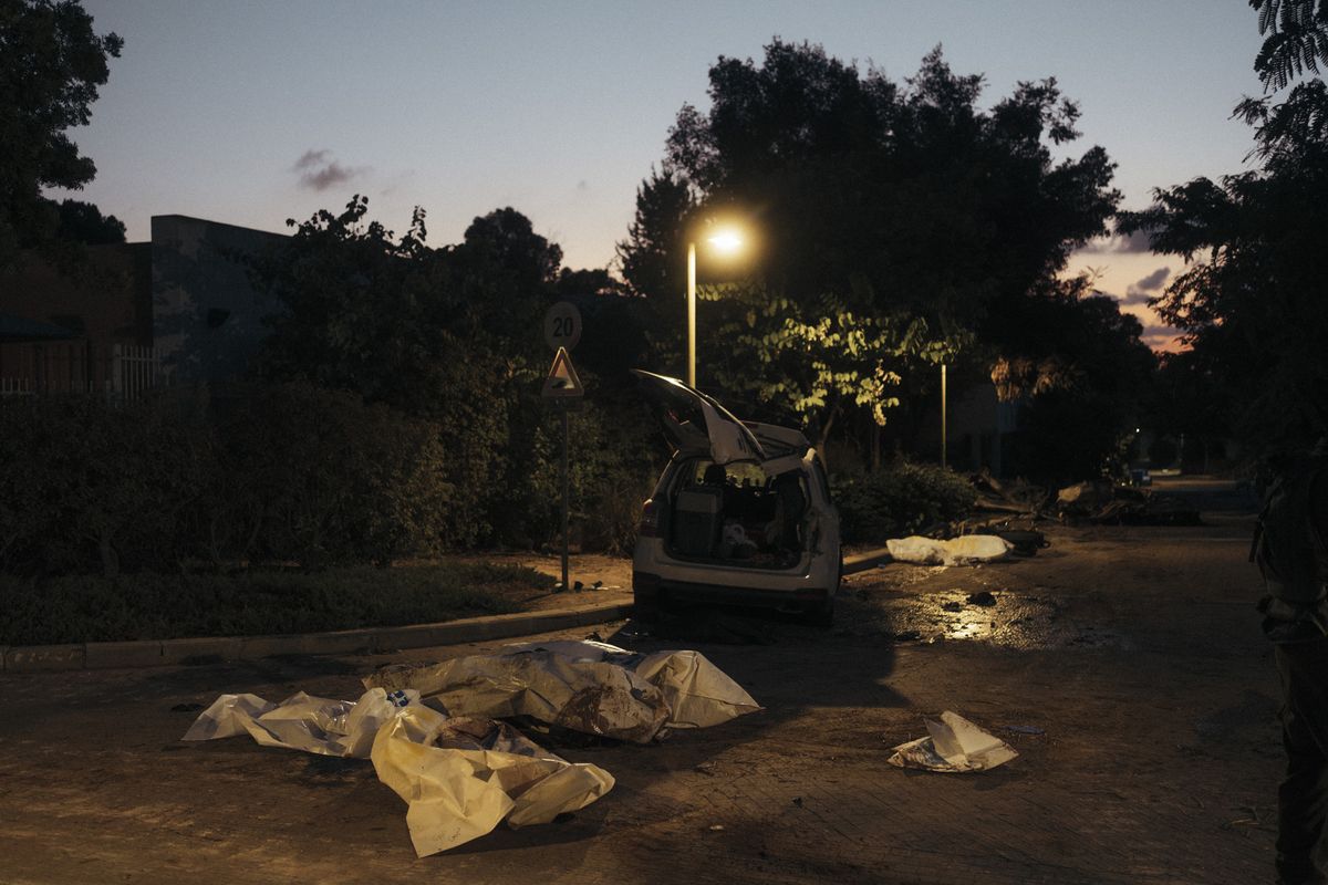 Bodies of civilians are shown scattered on the roads of Kibbutz Be’eri, Israel, on Oct. 11, 2023. (Lorenzo Tugnoli/For The Washington Post)