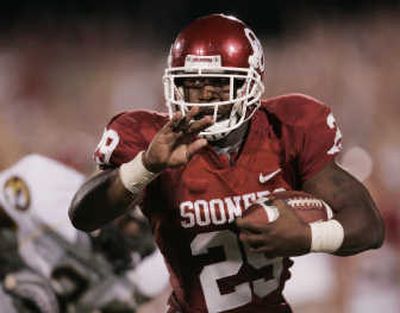 
Oklahoma's Chris Brown runs 17 yards for a touchdown against Missouri on Saturday. Associated Press
 (Associated Press / The Spokesman-Review)