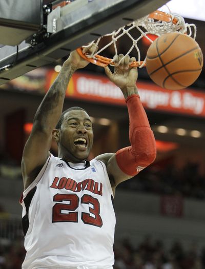 Louisville forward Terrence Jennings scores in the upset of Butler.  (Associated Press)