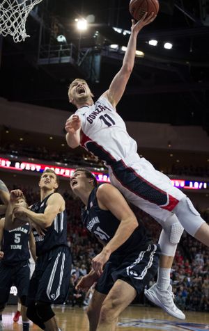 Gonzaga forward Domantas Sabonis (11) takes a shot over the back of BYU forward Luke Worthington (41)in the first half of a WCC men's tournament championship basketball game, Tuesday, March 10, 2015, at the Orleans Arena in Las Vegas, Nevada. (The Spokesman-Review)