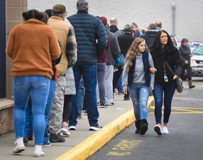 Parents form a line outside Eastpoint Church in Spokane Valley to pick up their children who were evacuated from Central Valley High School because of a threat discovered on a restroom wall on Friday, Nov. 22, 2019. (Dan Pelle / The Spokesman-Review)