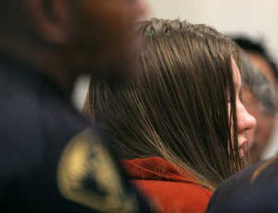 
Michele Anderson appears in court before pleading not guilty to six murder charges at the King County Courthouse in Seattle on Thursday. The killings of Anderson's family took place on Christmas Eve in rural Carnation, east of Seattle. Anderson's boyfriend, Joseph McEnroe, also pleaded not guilty to the charges.
 (Associated Press / The Spokesman-Review)