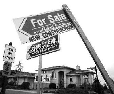 
Signs point the way to new homes for sale in the West Hills of Portland, Ore., in 2005, when adjustable-rate, subprime mortgages were popular. 
 (Associated Press / The Spokesman-Review)