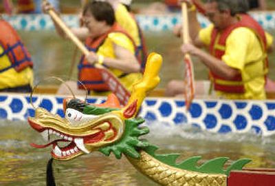 
Teams of 20 paddlers are organizing to paddle 46-foot-long Dragon Boats, such as the ones shown above, in races on the Spokane River near Division Street on July 27 as part of the Sister Cities International Conference. 
 (File/Associated Press / The Spokesman-Review)