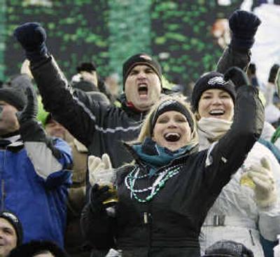 
Young fans, such as this group cheering the Eagles Sunday, may have never seen a major championship in their city.
 (Associated Press / The Spokesman-Review)