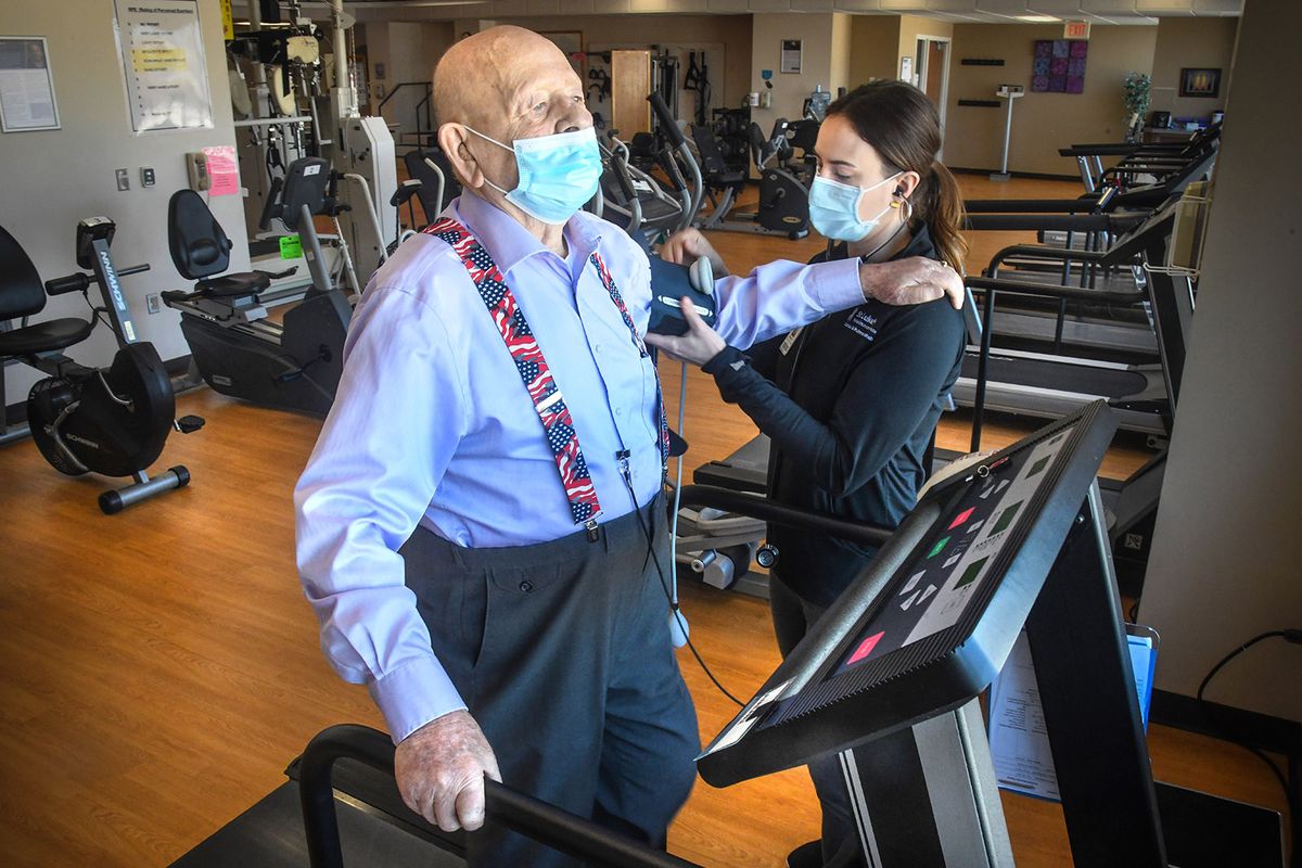 Donald Hitzel is a 101-year-old WWII veteran who’s going strong as a current cardiac rehab patient at St. Luke’s Rehabilitation Institute after a recent valve replacement. Here on March 3, Hitzel and exercise physiologist Rawnie Oehler demonstrate his routine of treadmill work and a blood pressure check at St. Luke’s.  (Dan Pelle/The Spokesman-Review)