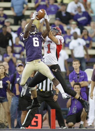 UW’s Desmond Trufant (6) intercepts a pass intended for Brandon Kaufman in the end zone to thwart EWU. (Associated Press)