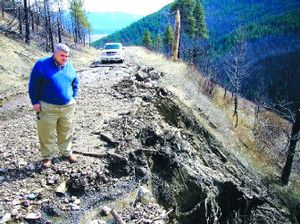 
Bonners Ferry Mayor Darrell Kerby examines a road that washed out this spring in the Myrtle Creek Valley, which is the source of the town's drinking water. The valley burned in 2003 and has since been plagued by washouts and erosion. 
 (James Hagengruber / The Spokesman-Review)
