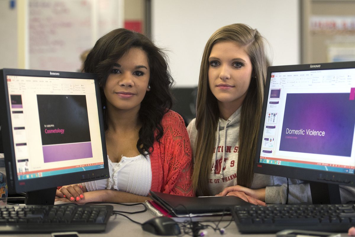 North Central student Kaihla Reilly, left, did her senior project on cosmetology, while friend Courtney Levien crafted a domestic violence report. (Dan Pelle)