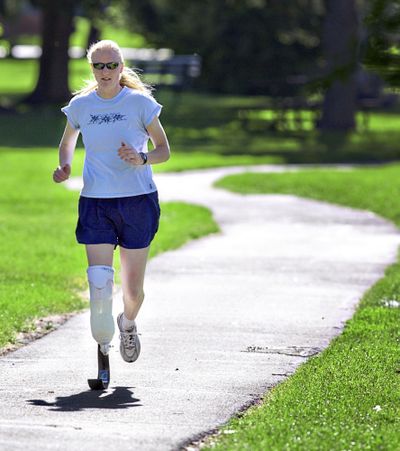 Sara Brown runs through Washington Park in Laramie, Wyo., on Tuesday.  (Associated Press / The Spokesman-Review)