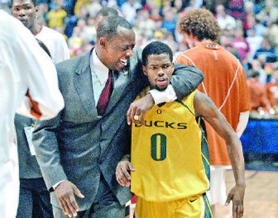 Coach Ernie Kent hugs Aaron Brooks, who scored a game-high 22 points to help send Oregon to the Sweet 16 for the first time since 2002. 
 (Dan Pelle / The Spokesman-Review)