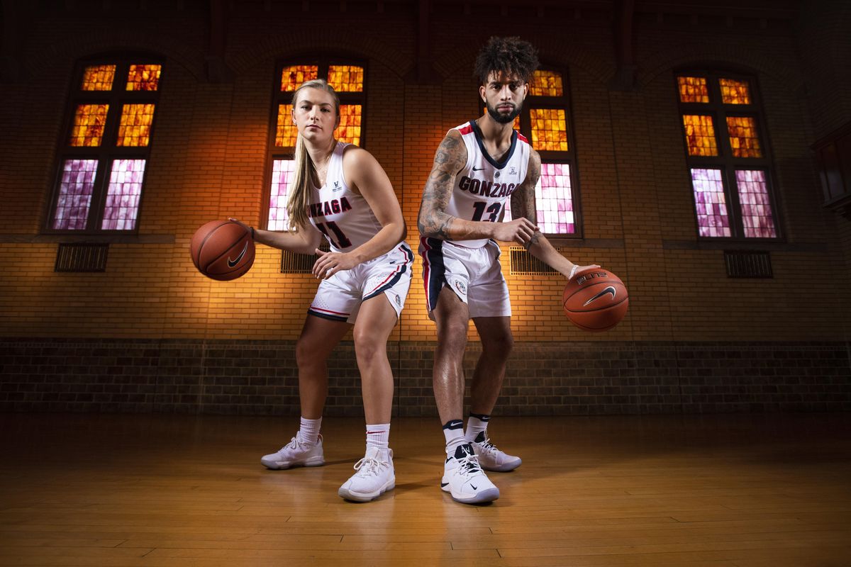 Gonzaga basketball players Laura Stockton and Josh Perkins pose for a photo in the Hutton Settlement auditorium, Wed., Oct. 24, 2018. (Colin Mulvany / The Spokesman-Review)