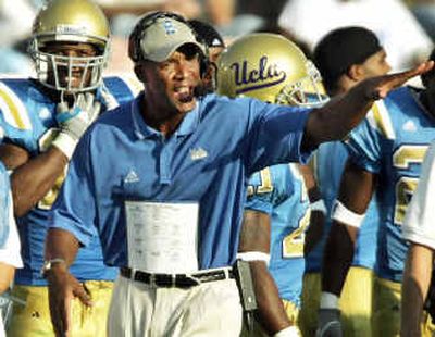 
UCLA and head coach Karl Dorrell will have their work cut out for them come Saturday: They enter the game against top-ranked USC as three-touchdown underdogs. 
 (Associated Press / The Spokesman-Review)