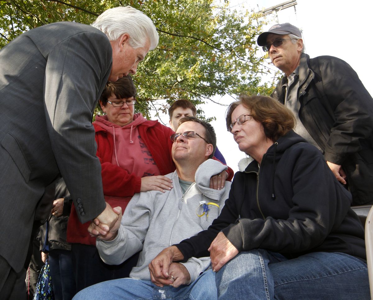 Gloucester County Prosecutor Sean Dalton greets Paul Spadafora and Mary Pasquale, the uncle and grandmother of Autumn Pasquale at a gathering outside town hall Tuesday, Oct. 23, 2012, in Clayton, N.J., not far from where a body that Dalton identified as the missing 12-year-old girl