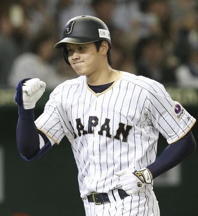 In this Nov. 12, 2016 photo, Japan's designated hitter Shohei Otani reacts after hitting a solo home run off Netherlands starter Jair Jurrjens in the fifth inning of their international exhibition series baseball game at Tokyo Dome in Tokyo. (Koji Sasahara / Associated Press)