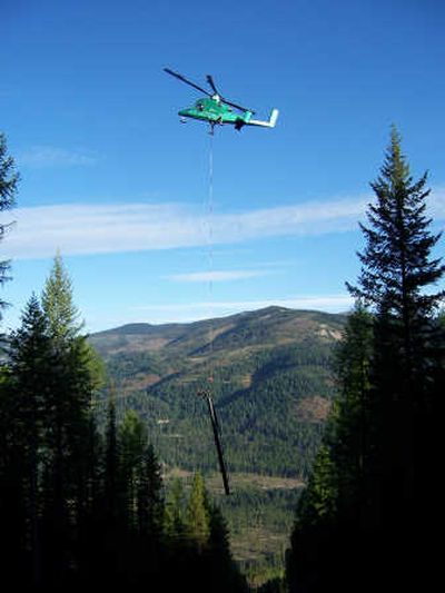 
A helicopter flies in new line towers Friday at Lookout Pass Ski Area.Photo courtesy Lookout Pass
 (Photo courtesy Lookout Pass / The Spokesman-Review)