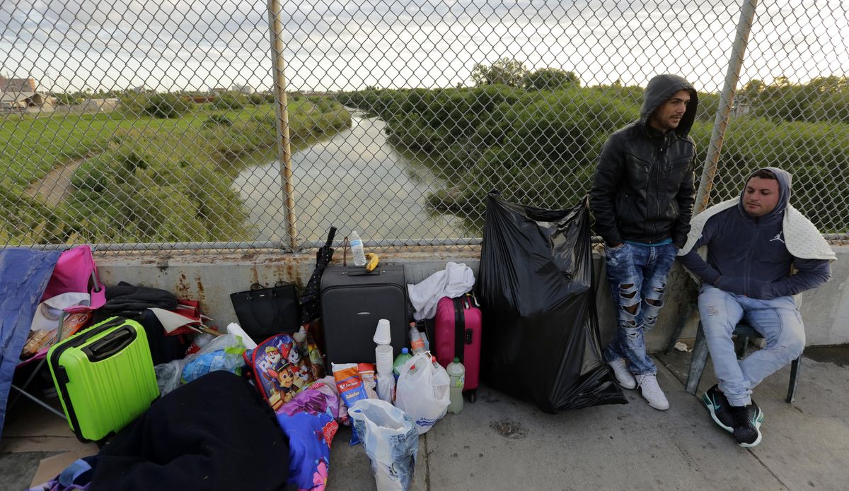 Yenly Morales, left, and Yenly Herrera, right, immigrants from Cuba seeking asylum in the United States, wait Nov. 2, 2018, on the Brownsville and Matamoros International Bridge in Matamoros, Mexico. The U.S. government will expand its policy requiring asylum seekers to wait outside the country in one of Mexico’s most dangerous cities. According to officials for two congressional Democrats, the Department of Homeland Security says it will implement its “Migrant Protection Protocols” in Brownsville, Texas, across the border from Matamoros, Mexico. Matamoros is in Mexico’s Tamaulipas state, which the U.S. government warns citizens not to visit due to violence and kidnappings. (Eric Gay / Associated Press)