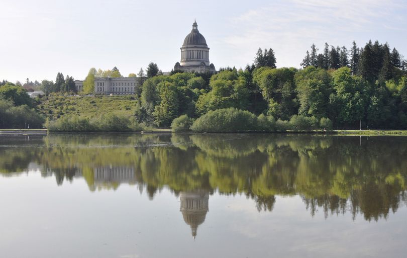 OLYMPIA -- The Washington state Legislative Building and other buildings on the Capitol Campus reflected in Capitol Lake, May 19, 2011. (Jim Camden/The Spokesman-Review)