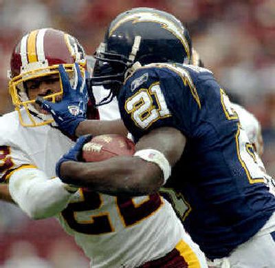 
Carlos Rogers and the Redskins had a tough time containing Chargers running back LaDainian Tomlinson, who ran for 147 of his 184 yards after halftime.
 (Associated Press / The Spokesman-Review)