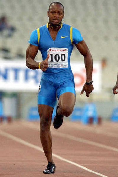 
Asafa Powell of Jamaica clocked a 9.77 in the men's 100-meter dash.
 (Associated Press / The Spokesman-Review)