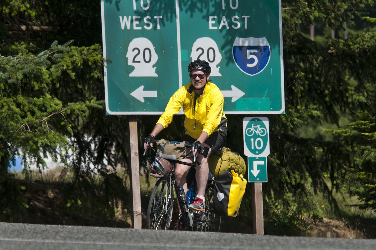 Nick Deshais heads away from Anacortes, Wash., on June 10 as he begins his 482-mile ride on the U.S. Bicycle Route 10 trail towards his destination of Sandpoint. (Dan Pelle)