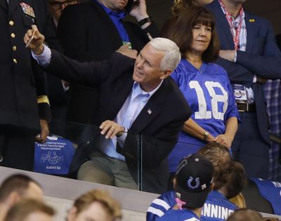 Vice President Mike Pence takes a photo with a fan before an NFL football game between the Indianapolis Colts and the San Francisco 49ers, Sunday, Oct. 8, 2017, in Indianapolis. (Michael Conroy / Associated Press)