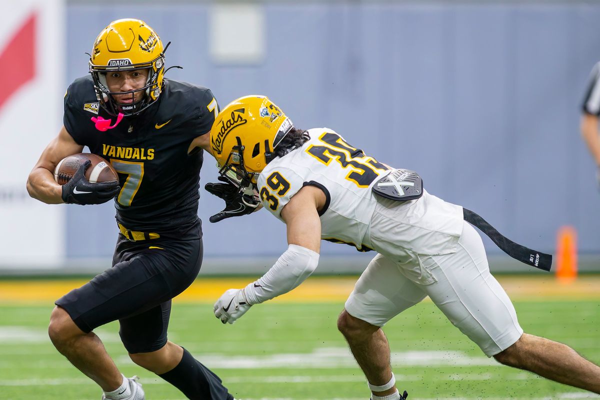 Idaho receiver Emmerson Cortez-Menjivar, left, drives by defensive back Jacob Skobis in a scrimmage on April 25.  (Geoff Crimmins/For The Spokesman-Review)