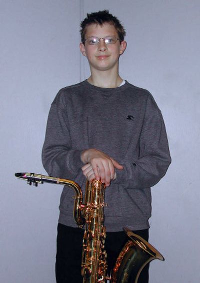 
Tony Orth, an eighth-grader at Centennial Middle School, plays the baritone saxophone.
 (Jennifer Larue / The Spokesman-Review)