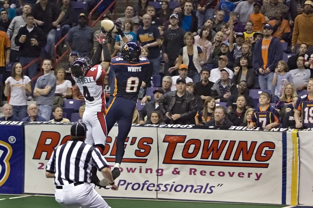 Spokane’s Markee White pulls down a long pass over Cleveland’s Carlos Campbell in AFL play Friday night in the Spokane Arena. Special to  (Bruce Twitchell Special to)