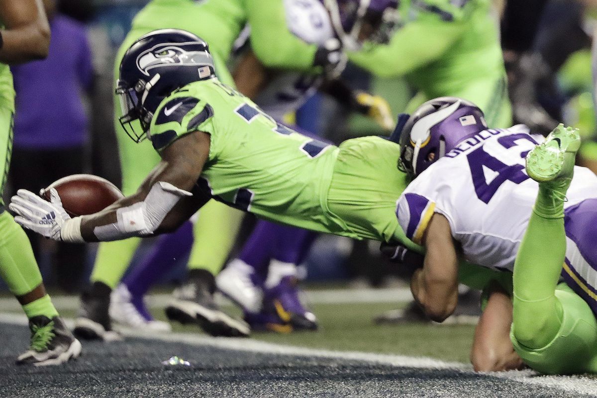 Chris Carson dives into the end zone for a Seahawks touchdown against the Minnesota Vikings in the second half of an NFL football game, Monday, Dec. 10, 2018, in Seattle. (Ted S. Warren / Associated Press)