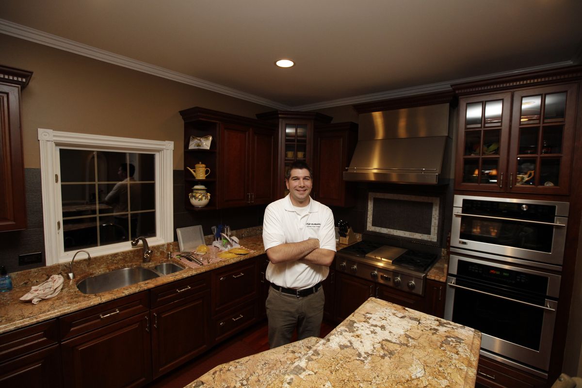 David Frank poses at his home in Libertyville, Ill., where Frank does just about all his own home repairs and remodeling. (Associated Press)