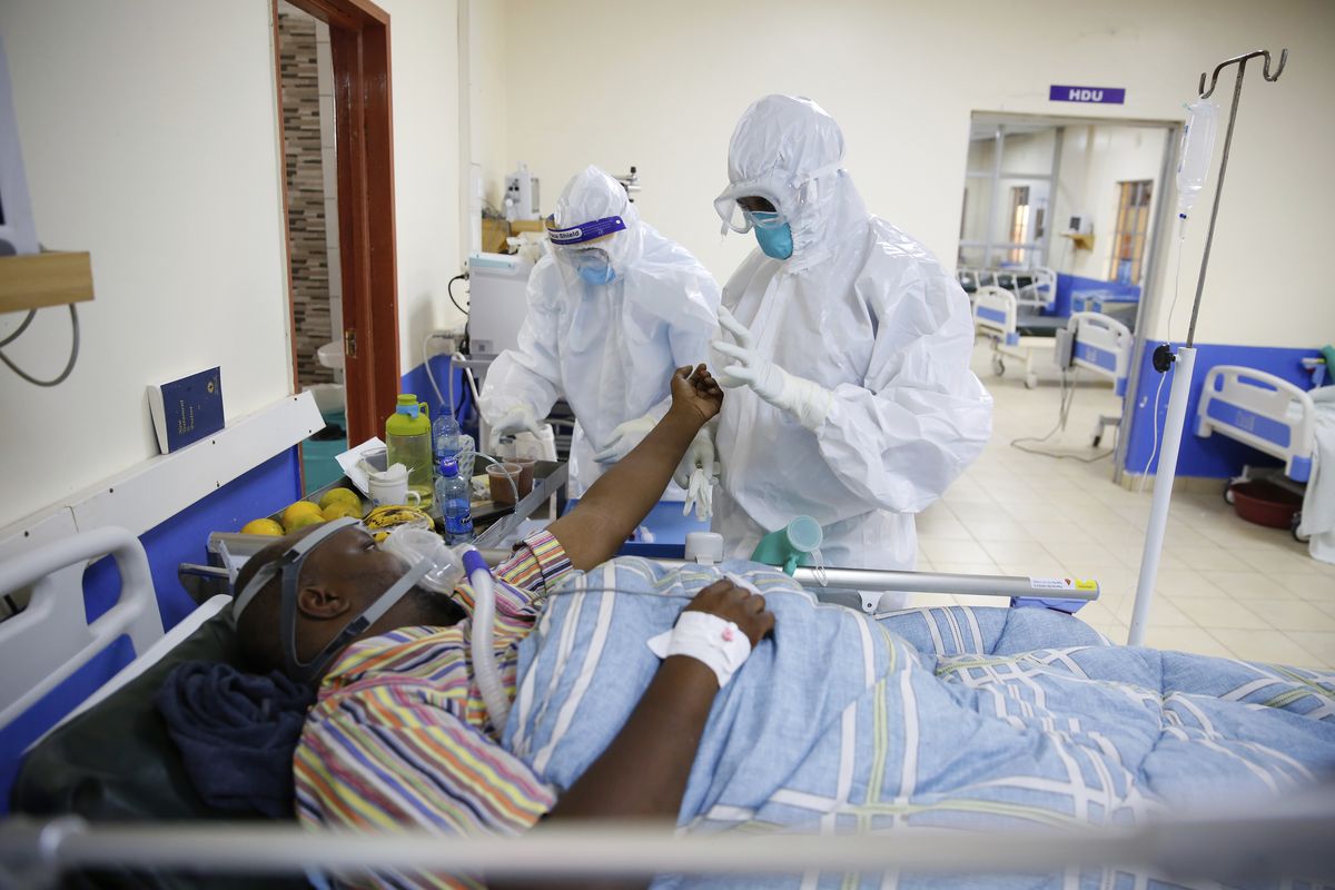In this Thursday June 17, 2021 photo, medical staff wearing protective equipment attend to patients affected by COVID-19, on the Intensive Care Unit (ICU) of the Machakos County Level-5 hospital in Machakos, Kenya. Driven by the delta variant, a new wave of COVID-19 is sweeping across the African continent where new cases, hospital admissions, and deaths are increasing.  (Brian Inganga)