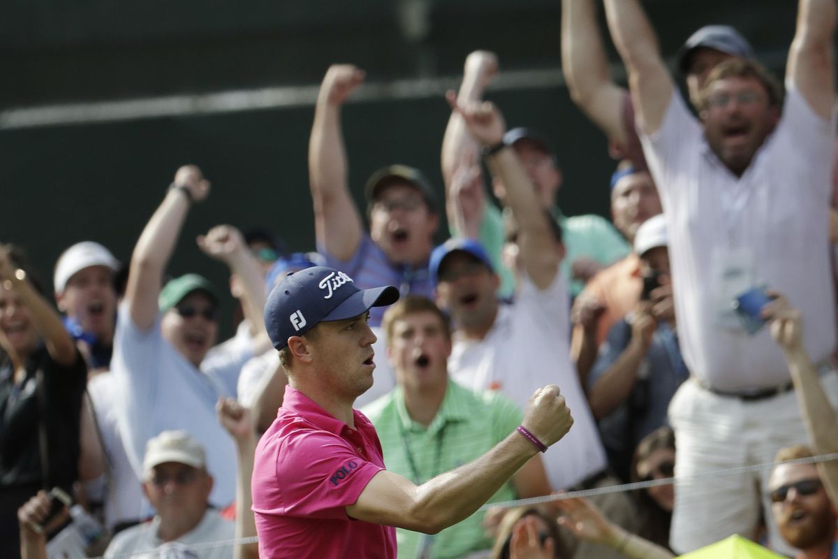 Justin Thomas celebrates after chipping in for a birdie on the 13th hole during the final round of the PGA Championship golf tournament at the Quail Hollow Club Sunday, Aug. 13, 2017, in Charlotte, N.C. He won the tournament for his first major victory. (John Bazemore / Associated Press)