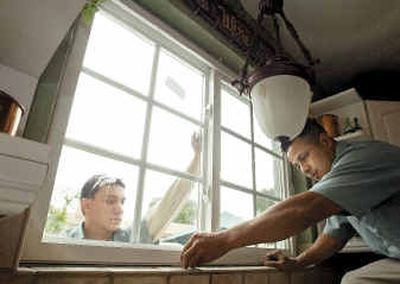 
Angel Locano, left, and Juan Valencia install solid vinyl windows at the home of Joe and Michelle Endicott in Cypress, Calif.Angel Locano, left, and Juan Valencia install solid vinyl windows at the home of Joe and Michelle Endicott in Cypress, Calif.
 (Orange County RegisterOrange County Register / The Spokesman-Review)