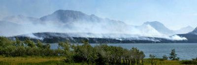 
A wildfire burns along the shore of St. Mary Lake in Glacier National Park, Mont., on Monday. 
 (Associated Press / The Spokesman-Review)