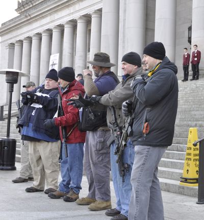 OLYMPIA -- Gun rights supporters, most of them openly carrying their weapons, gather on the steps of the Capitol Building for a rally on Jan. 13, 2017 (Jim Camden/The Spokesman-Review)
