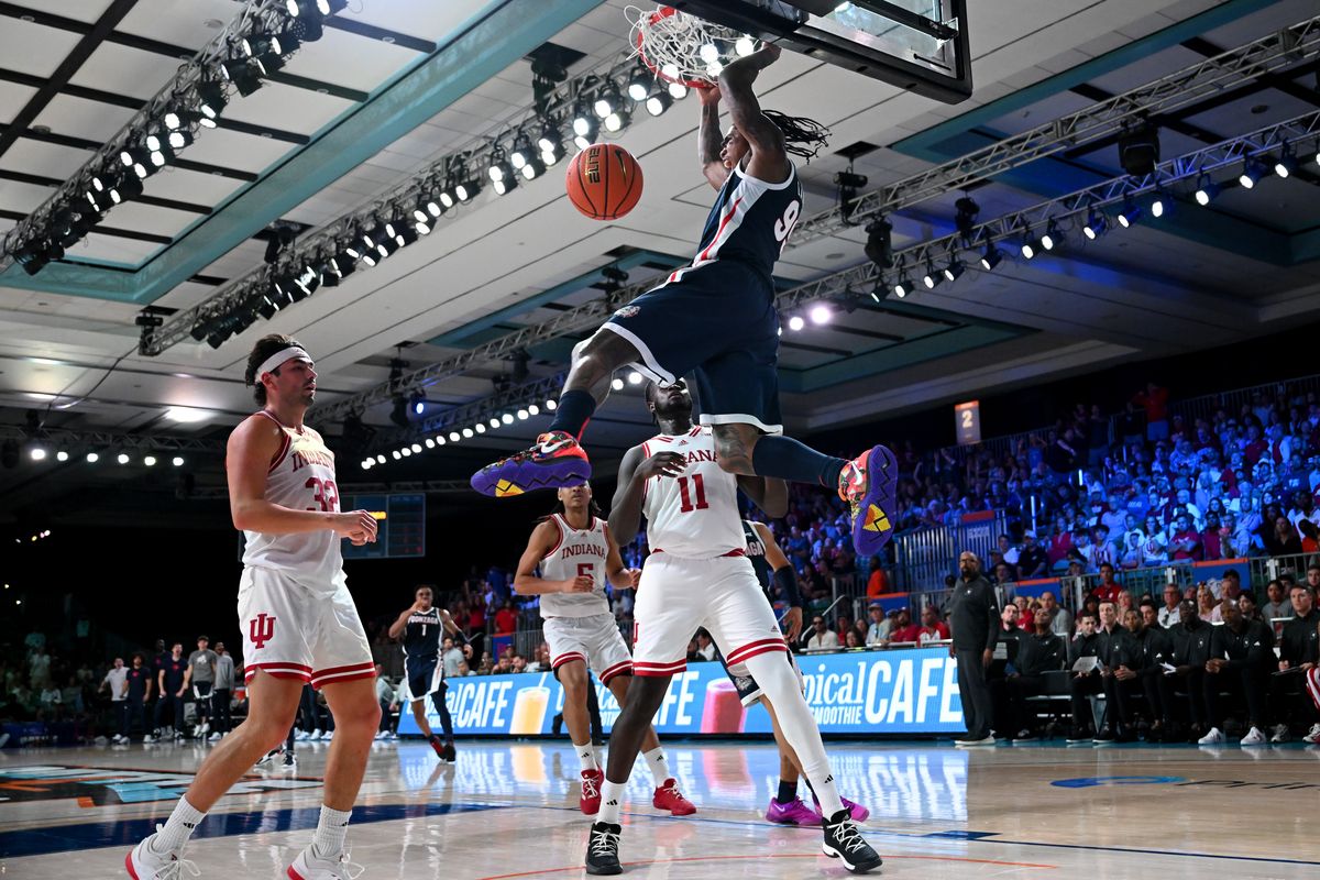 Gonzaga Bulldogs guard Khalif Battle (99) dunks the ball as Indiana Hoosiers center Oumar Ballo (11) and guard Trey Galloway (32) react during the first half of a college basketball game on Thursday, Nov. 28, 2024, at Paradise Island, Bahamas.  (Tyler Tjomsland/The Spokesman-Review)