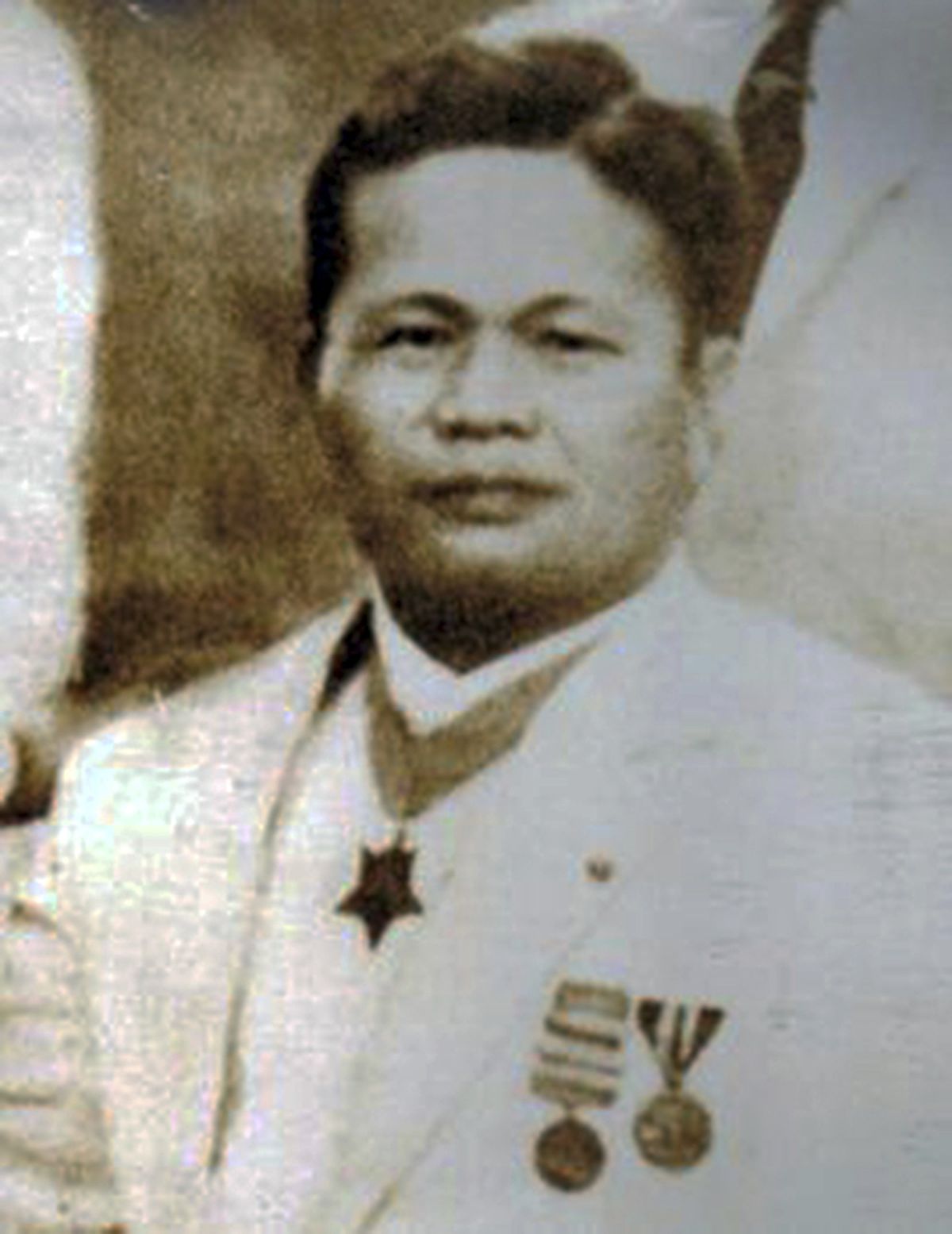In this 1939 photo provided by the Trinidad family is Telesforo Trinidad in the Philippines. Asian Americans, veterans and civilians in the U.S. and the Philippines are campaigning to name a Navy warship for the Filipino sailor who bravely rescued two crew members when their ship caught fire more than century ago, earning him a prestigious and rare Medal of Honor.  (HONS)