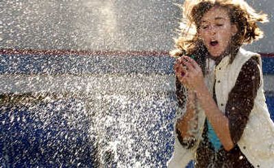 
Coeur d'Alene High School 10th-grader Sarah Jordan reacts to an exploding water balloon during the second intramural event of the year at the school.  
 (Kathy Plonka / The Spokesman-Review)