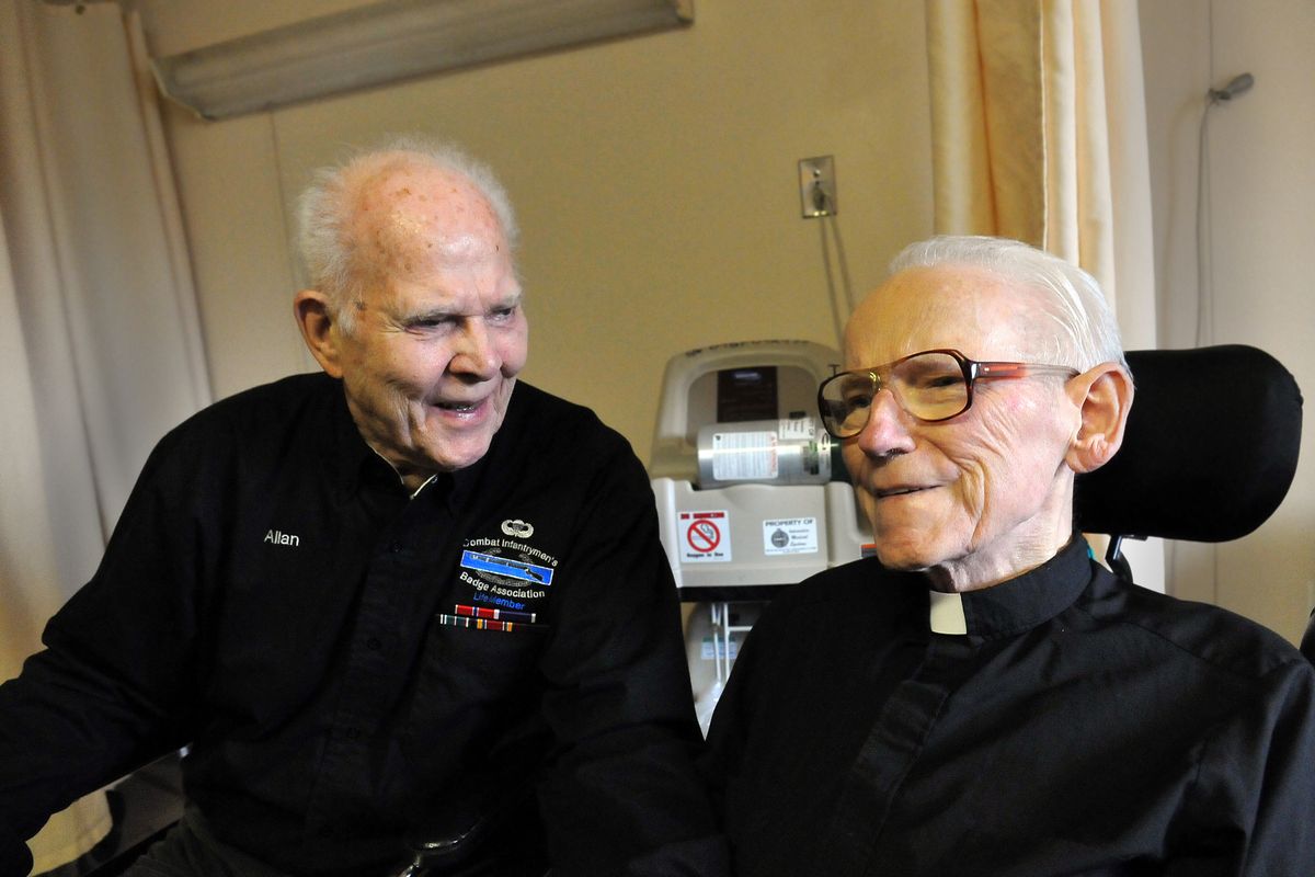 Allan Wood, left, visits with Father Arnold Schoffelmeer at Royal Park Care Center in February 2011. The men met in a Sacred Heart hospital room on Veterans Day 2010. (Jesse Tinsley)