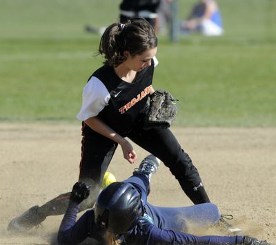 Lake City’s Annie Chadderdon beats the tag attempt of Post Falls’ Brooke Litalien at second base in Idaho 5A Region I championship game at Lake City on Wednesday. (Jesse Tinsley)